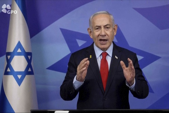 In this screen grab image from video provide by the Israeli Government Press Office, Israeli Prime Minister Benjamin Netanyahu makes a televised statement Tuesday, Nov. 26, 2024, in Jerusalem, Israel. ...