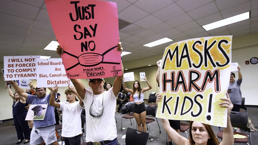 August 30, 2021, Viera, Florida, United States: People demonstrate with placards at an emergency meeting of the Brevard County, Florida School Board in Viera to discuss whether face masks in local sch ...