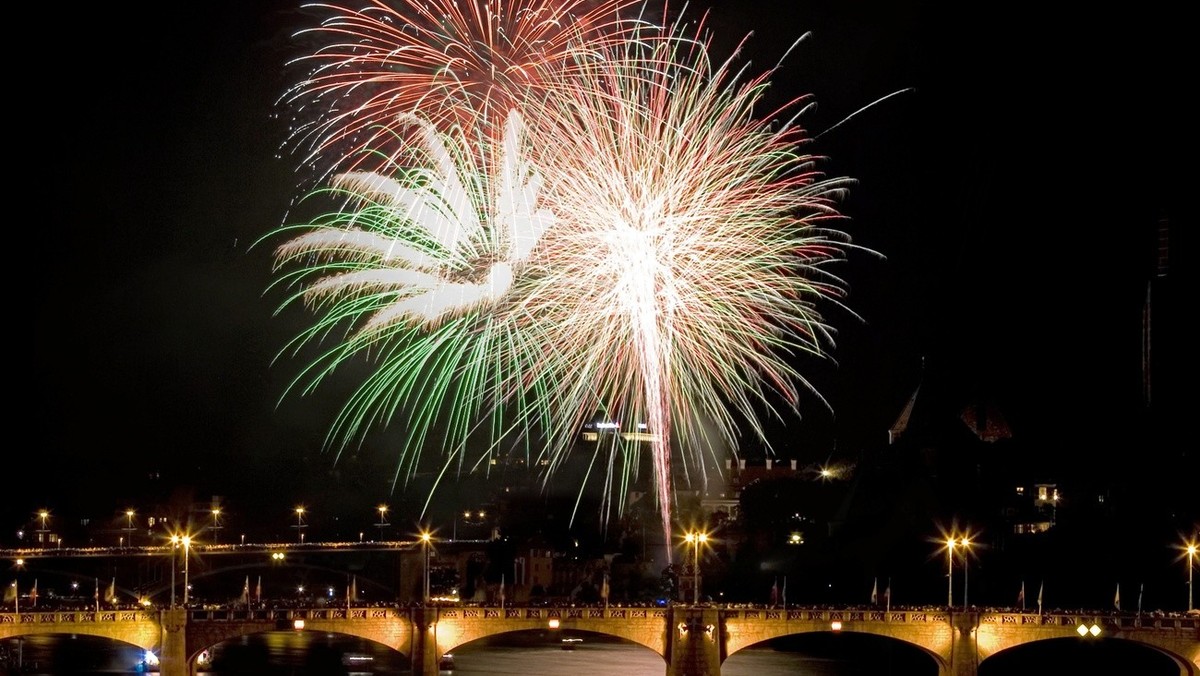 Fireworks explode above the river Rhine in Basel, Switzerland, on Tuesday July 31, 2007. The city of Basel celebrated Switzerland's National Day, which is officially on August 1, one day ahead. ( ...