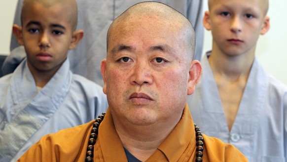 epa12267503 (FILE) - Shi Yongxin (front), abbot of the Chinese Shaolin temple in Henan, speaks at a press conference held at the Chinese Culture Centre in Berlin, Germany, 07 September 2012 (reissued  ...