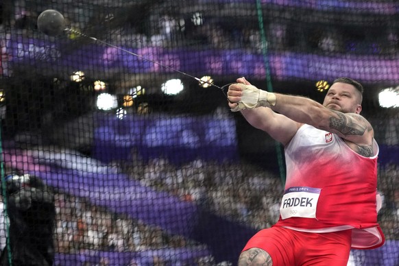 Pawel Fajdek, of Poland, competes in the men&#039;s hammer throw final at the 2024 Summer Olympics, Sunday, Aug. 4, 2024, in Saint-Denis, France. (AP Photo/Bernat Armangue)
Pawel Fajdek