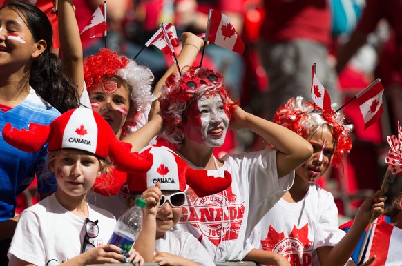 Young Canadian fans watch as Canada and Switzerland warm up before a FIFA Women&#039;s World Cup round of 16 soccer game in Vancouver, British Columbia, on Sunday June 21, 2015. (Darryl Dyck/The Canad ...