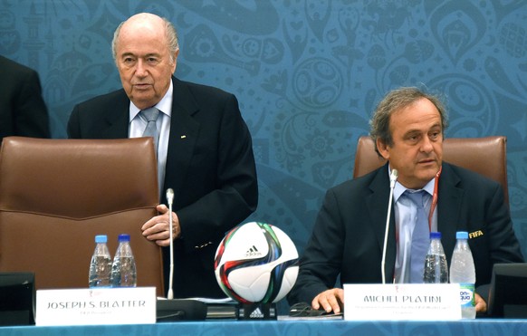epa09559437 (FILE) - FIFA president Joseph 'Sepp' Blatter (L) takes his seat next to UEFA president Michel Platini (R) during a seminar ahead of the Preliminary Draw for the FIFA World Cup 2018 in St.Petersburg, Russia, 25 July 2015 (re-issued on 02 November 2021). Former FIFA officials Sepp Blatter and Michel Platini have been charged with fraud in Switzerland over a controversial 1.58 million euro payment, Swiss federal prosecutors confirmed on 02 November 2021. EPA/MARCUS BRANDT GERMANY OUT *** Local Caption *** 52089297