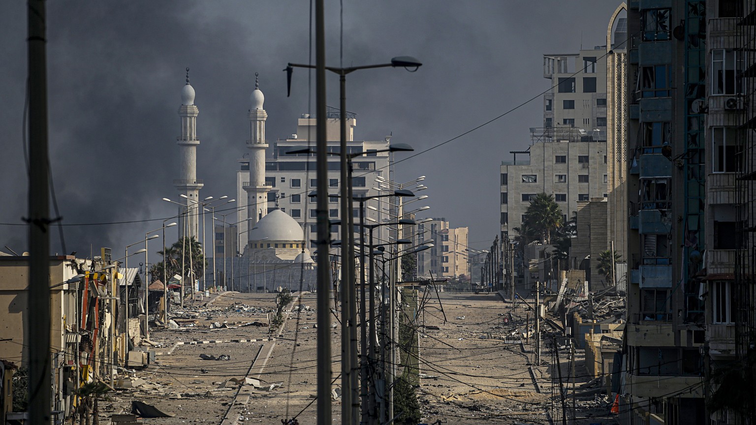 epa10954344 A general view of debris at a deserted street following Israeli air strikes in Gaza City, 02 November 2023. More than 8,500 Palestinians and at least 1,400 Israelis have been killed, accor ...