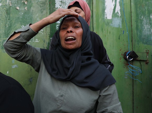 epa10284204 Relatives of Islamic Jihad militant Farouq Salama, 28 years old, react during his funeral at Jenin refugee camp near the West Bank city of Jenin, 03 November 2022. According to the Palesti ...