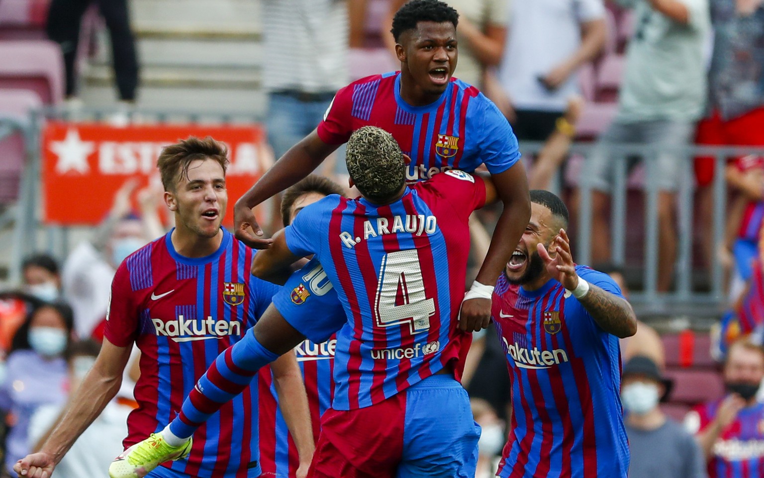 Barcelona&#039;s Ansu Fati celebrates after scoring his side&#039;s third goal during a Spanish La Liga soccer match between FC Barcelona and Levante at the Camp Nou stadium in Barcelona, Spain, Sunda ...