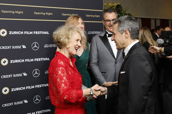 The mayor of Zurich, Corine Mauch, left, and Swiss Federal President Ignazio Cassis, shake hands on the Green Carpet for the Opening Night of the 18th Zurich Film Festival (ZFF) in Zurich, Switzerland ...