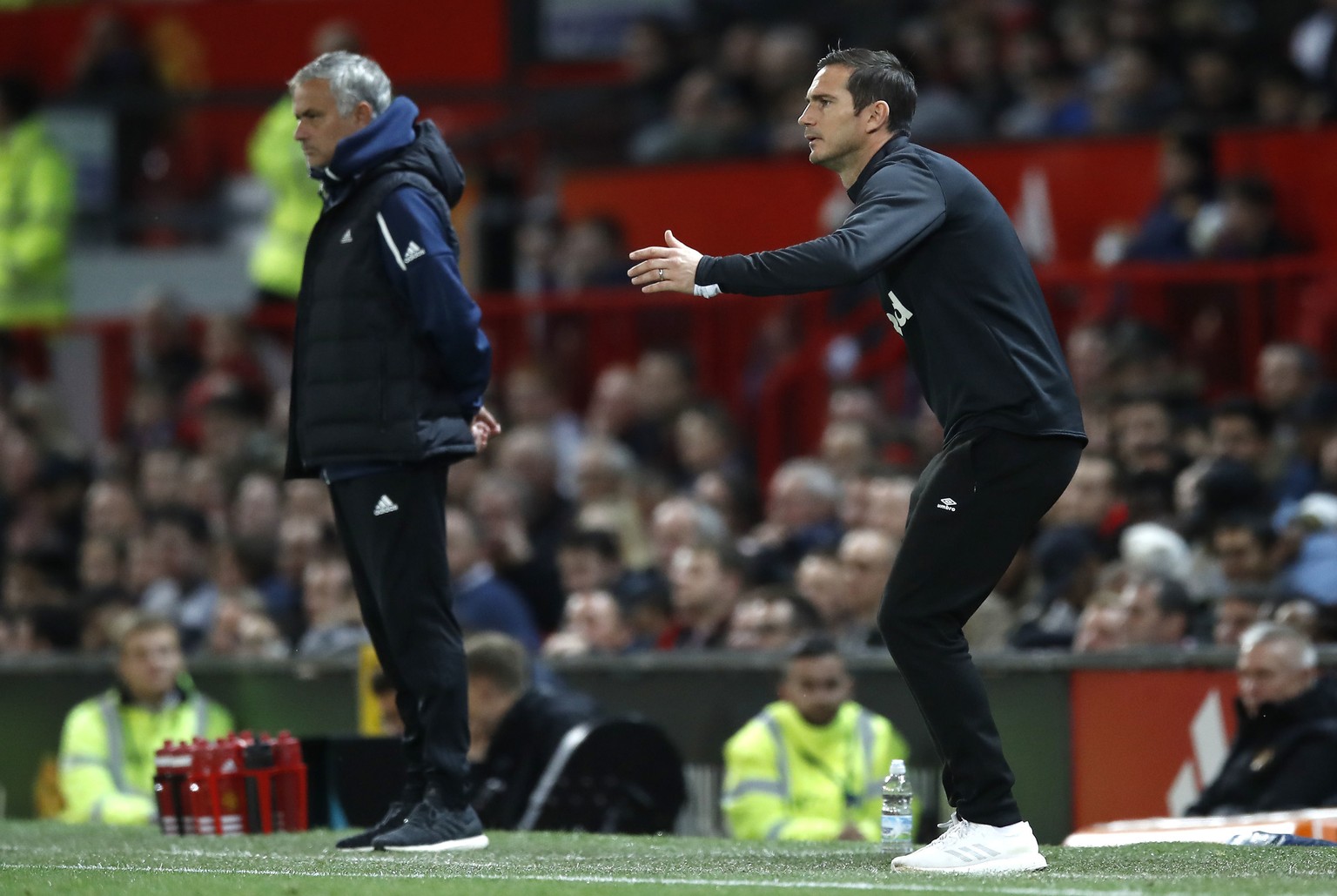 Derby County manager Frank Lampard gestures on the touchline with Manchester United manager Jose Mourinho, left, during their English League Cup, third round soccer match at Old Trafford in Manchester ...