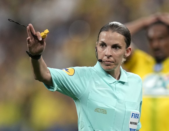 Referee Stephanie Frappart gives directions during the French Cup final soccer match between Nice and Nantes at the Stade de France stadium, in Saint Denis, north of Paris, Saturday, May 7, 2022. (AP  ...