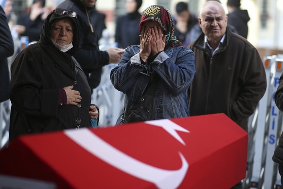 Relatives and friends of Arzu Ozsoy and her 15-year-old daughter Yagmur Ucar, who were killed in Sunday's explosion on Istiklal Avenue, attend their funeral in Istanbul, Turkey, Monday, Nov.