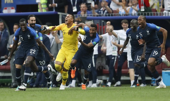 French players celebrate at the end of the final match between France and Croatia at the 2018 soccer World Cup in the Luzhniki Stadium in Moscow, Russia, Sunday, July 15, 2018. France won 4-2. (AP Pho ...