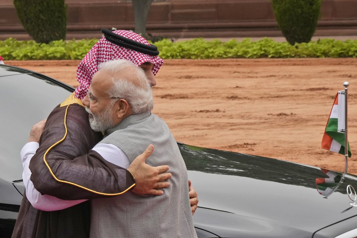Indian Prime Minister Narendra Modi hugs Crown Prince Mohammed bin Salman of Saudi Arabia upon his arrival for a ceremonial reception at the Indian presidential palace, in New Delhi, India, Monday, Se ...