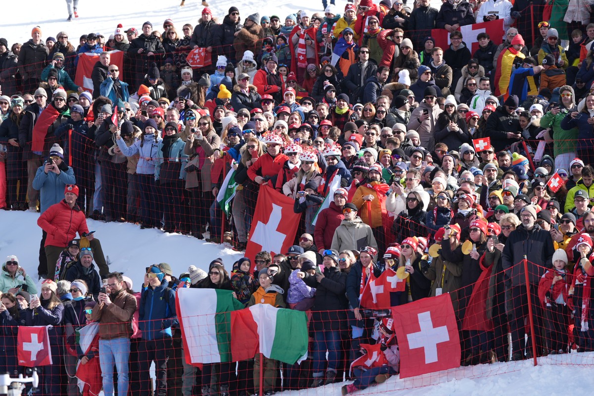 Fans watch an alpine ski men's downhill race, at the 2026 Winter Olympics, in Bormio, Italy, Saturday, Feb. 7, 2026. (AP Photo/Rebecca Blackwell)
Milan Cortina Olympics Alpine Skiing