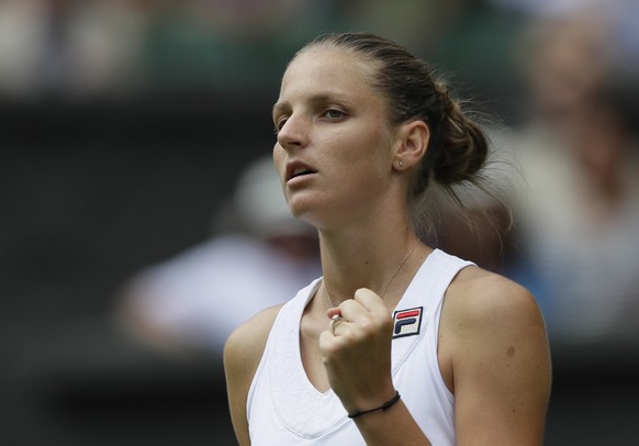 Czech Republic&#039;s Karolina Pliskova reacts after winning a point to Victoria Azarenka, of Belarus, during their women&#039;s singles match, on the third day of the Wimbledon Tennis Championships,  ...