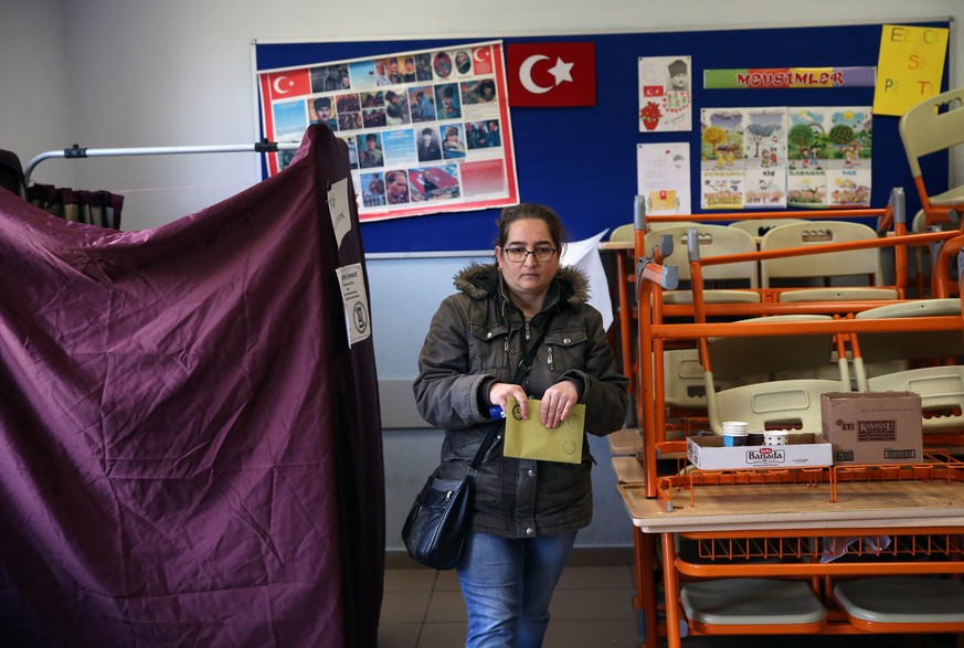 epa07475514 A woman casts the ballot at a polling station for the local elections in Istanbul Turkey, 31 March 2019. Some 57 milion people will vote in local elections in Turkey&#039;s capital and the ...