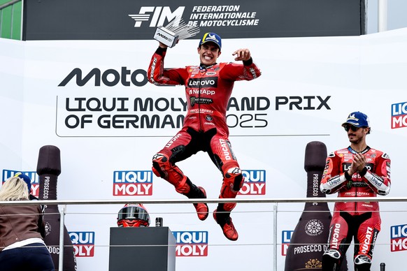 epa12235520 Ducati Lenovo Team rider Marc Marquez (C) of Spain celebrates next to third placed Ducati Lenovo Team rider Francesco Bagnaia of Italy on the podium after winning the Moto GP race of the m ...