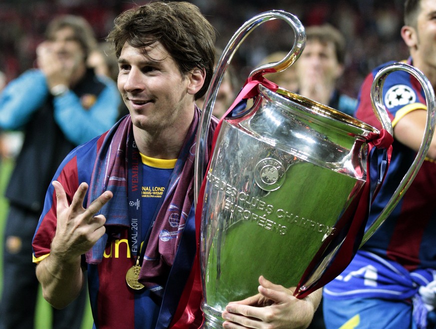 FILE - In this May 28, 2011 file photo Barcelona's Lionel Messi celebrates with the trophy after winning the Champions League final soccer match against Manchester United at Wembley Stadium, Lond ...