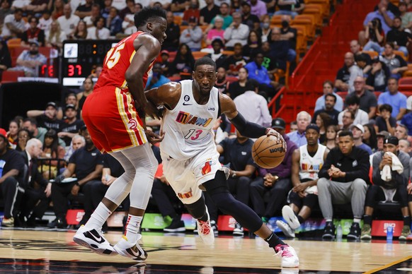 NBA, Basketball Herren, USA Atlanta Hawks at Miami Heat Mar 6, 2023 Miami, Florida, USA Miami Heat center Bam Adebayo 13 drives to the basket as Atlanta Hawks center Clint Capela 15 defends during the ...