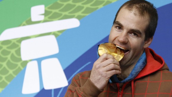 Didier Defago of Switzerland, gold medal winner of men&#039;s downhill race, poses before a media conference during the XXI Olympic Winter Games Vancouver 2010 in Whistler Creekside, British Columbia, ...