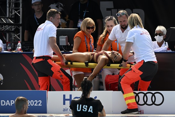 Anita Alvarez of United States is carried on stretcher after collapsing during the solo free final of the artistic swimming at the 19th FINA World Championships in Budapest, Hungary, Wednesday, June 2 ...