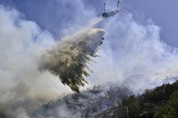 Fire retardant is dropped as firefighters battle the Rancho Fire in Laguna Beach, Calif., on Monday, July 7, 2025. (Jeff Gritchen/The Orange County Register via AP)
California Wildfires