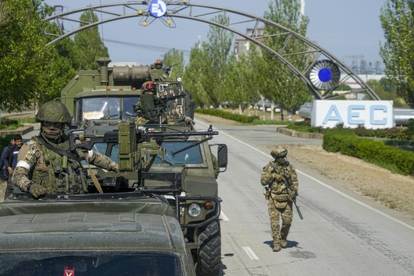 FILE - A Russian military convoy is seen on the road toward the Zaporizhzhia Nuclear Power Station, in Enerhodar, Zaporizhzhia region, in territory under Russian military control, southeastern Ukraine ...