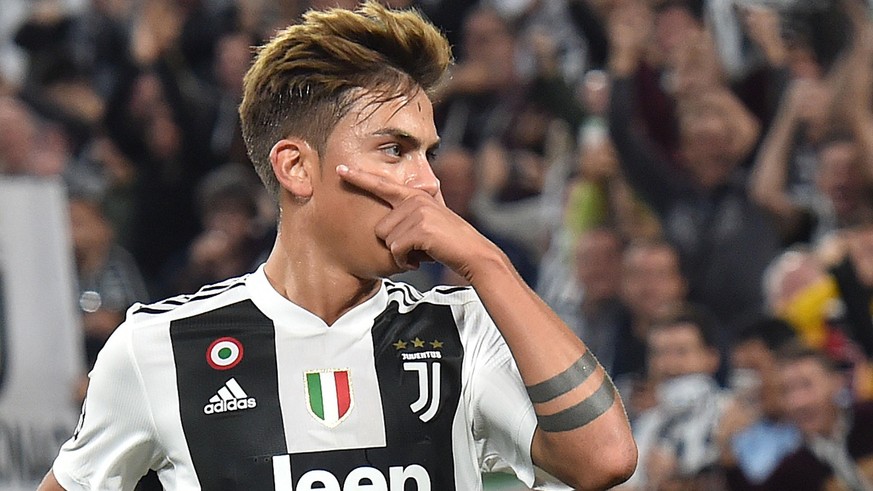 epa07064617 Juventus&#039; forward Paulo Dybala celebrates after scoring a goal during the UEFA Champions League group stage match between Juventus FC and BSC Young Boys Bern at the Allianz Arena in T ...