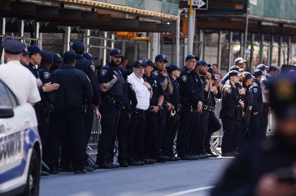 epa10558425 New York State Court officials line the street outside the New York Criminal Court in New York, New York, U.S. April 4, 2023. A Manhattan grand jury voted to indict former President Donald J... .