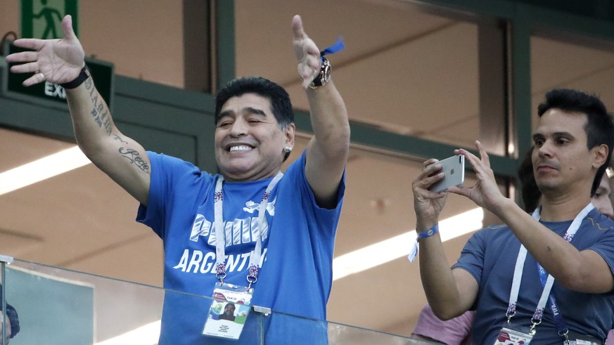 epa06828636 Argentinian soccer legend Diego Maradona (L) reacts prior to the FIFA World Cup 2018 group D preliminary round soccer match between Argentina and Croatia in Nizhny Novgorod, Russia, 21 Jun ...