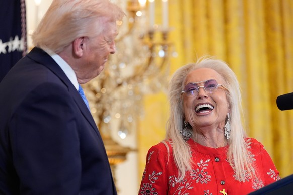 President Donald Trump listens as Miriam Adelson speaks during a Hanukkah reception in the East Room of the White House, Tuesday, Dec. 16, 2025, in Washington. (AP Photo/Alex Brandon)
Donald Trump