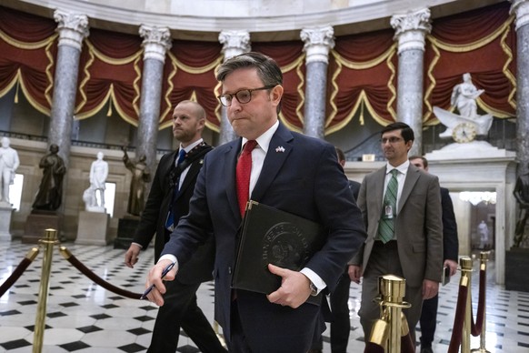 epa10975474 Republican Speaker of the House Mike Johnson walks to the House floor to vote on his proposed two-tier continuing resolution (CR) to keep the US government from shutting down in the US Cap ...