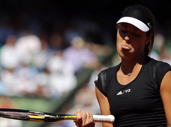 epa04783082 Ana Ivanovic of Serbia reacts as she plays against Lucie Safarova of Czech Republic during their semifinal match for the French Open tennis tournament at Roland Garros in Paris, France, 04 ...