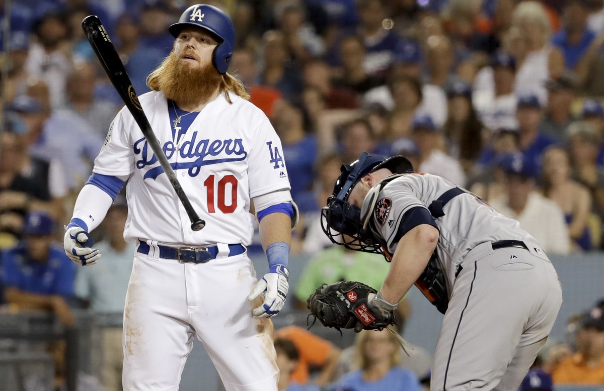 Los Angeles Dodgers' Justin Turner reacts after striking out against the Houston Astros during the eighth inning of Game 1 of baseball's World Series Tuesday, Oct. 24, 2017, in Los Angeles.  ...