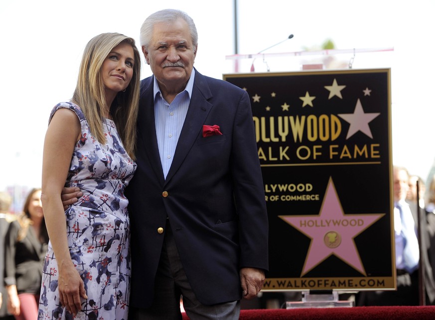FILE - Actress Jennifer Aniston, left, poses with her father, actor John Aniston, after she received a star on the Hollywood Walk of Fame in Los Angeles on Feb. 23, 2012. John Aniston, the Emmy-winnin ...