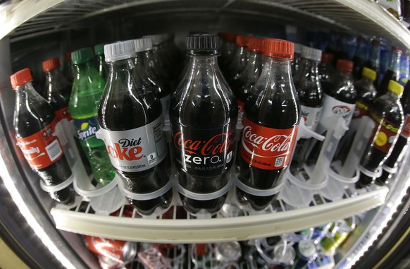 In this photo taken with a fisheye lens, a shelf of soft drinks are shown in a refrigerator at K &amp; D Market in San Francisco, Wednesday, Oct. 1, 2014. A tax on sodas and other sugar-laden drinks t ...