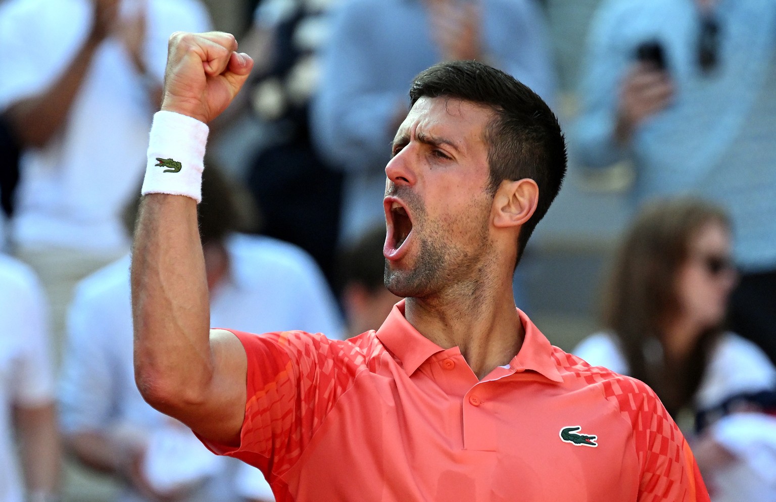 epa10676325 Novak Djokovic of Serbia reacts after winning against Karen Khachanov of Russia in their Men&#039;s quarterfinal match during the French Open Grand Slam tennis tournament at Roland Garros  ...