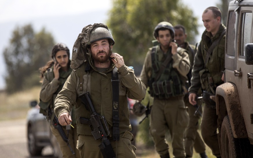 epa06722693 Israeli army officers walk after their meeting with the Chief of the General Staff, Lieutenant general Gadi Eisenkot at the army headquarter at the Israeli-Syrian border in the Golan Heigh ...