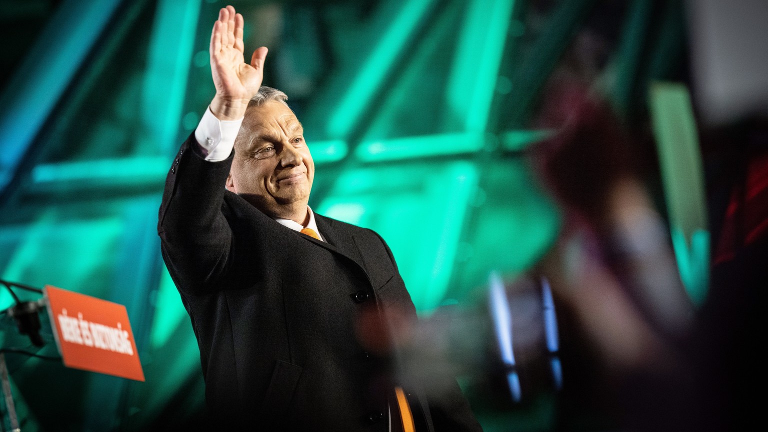 epa09868950 A handout photo made available by the Hungarian PM&#039;s Press Office shows Hungarian Prime Minister Viktor Orban waves to his supporters during the governing Fidesz-KDNP party&#039;s eve ...