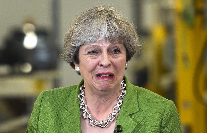 epaselect epa06001529 British Prime Minister, Theresa May reacts as she speaks to workers at a campaign event in Cross Manufacturing factory, during the battle bus tour of the United Kingdom in Bath,  ...