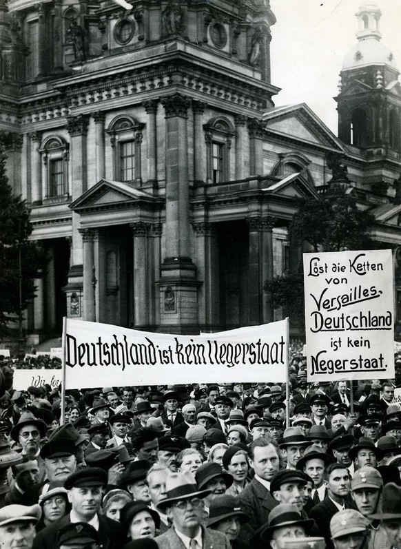 “Break the chains of Versailles, Germany is not a Negro state” German Nazi rally protesting the Treaty of Versailles on the 14th anniversary of its signing, 28 June 1933