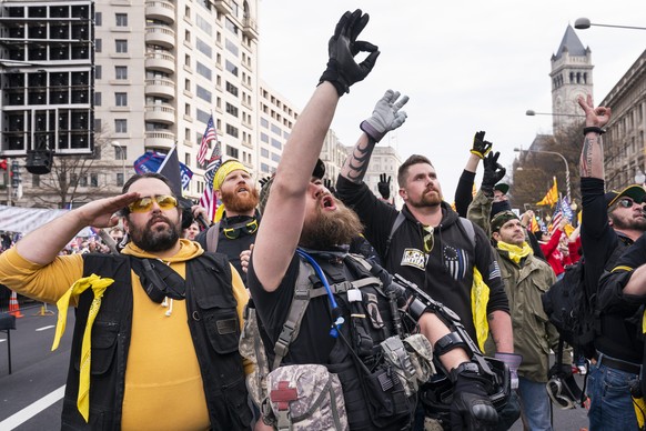 epa08880023 Members of the Proud Boys, a far-right extremist group with ties to white supremacy, gather for a rally to support US President Donald J. Trump's baseless claims of voter fraud in the US p ...