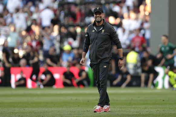 Liverpool coach Juergen Klopp walks at the field during a warms-up ahead of the Champions League final soccer match between Tottenham Hotspur and Liverpool at the Wanda Metropolitano Stadium in Madrid, Saturday, June 1, 2019. (AP Photo/Manu Fernandez)