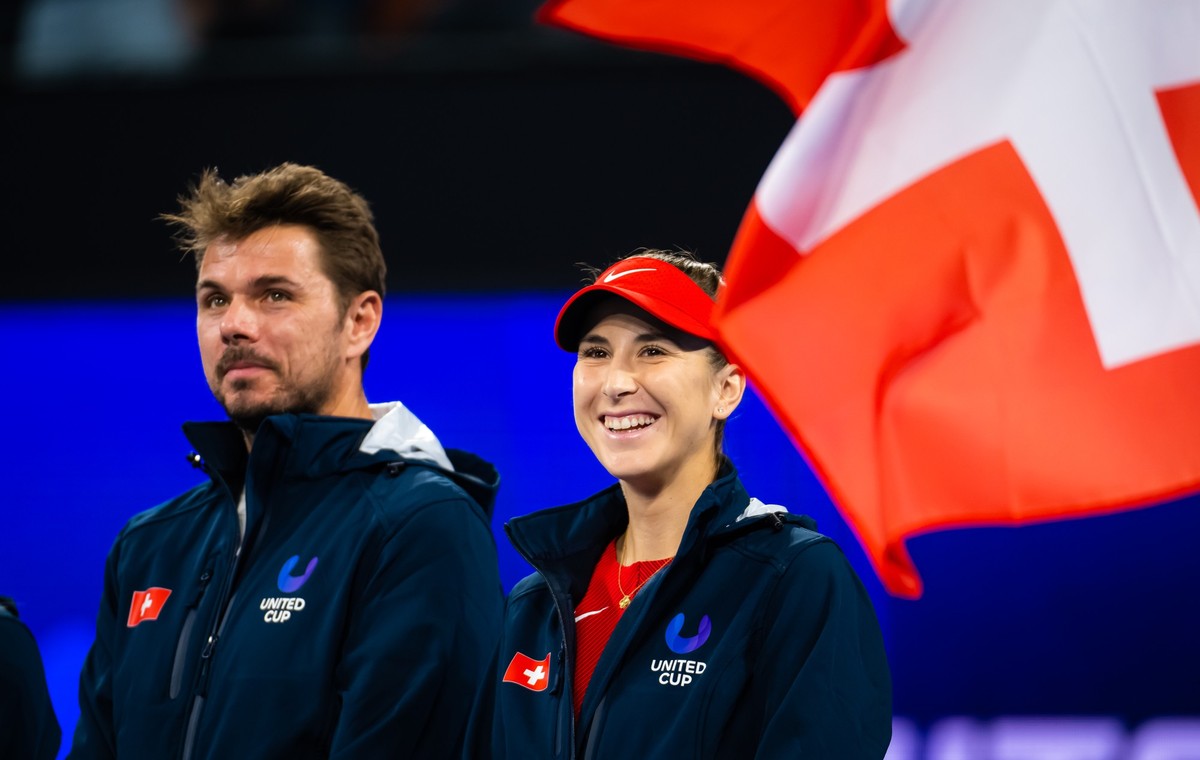BRISBANE, AUSTRALIA - DECEMBER 29: Stan Wawrinka of Switzerland and Belinda Bencic of Switzerland listen to the Swiss anthem before the first round-robin match on Day 1 of the United Cup at Pat Rafter ...