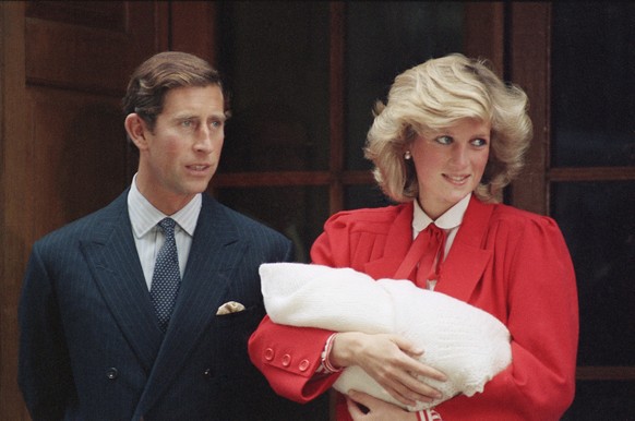 FILE - In this Sept. 16, 1984 file photo, Britain&#039;s Prince Charles and Princess Diana, leave St. Mary&#039;s Hospital in Paddington, London, with their new baby son. Princess Diana carries new ba ...