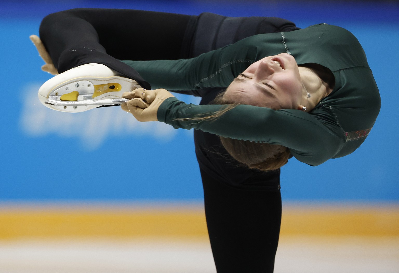 epa09748628 Figure skater Kamila Valieva of the Russian Olympic Committee in action during a practice session at the Beijing 2022 Olympic Games, Beijing, China, 12 February 2022. EPA/HOW HWEE YOUNG