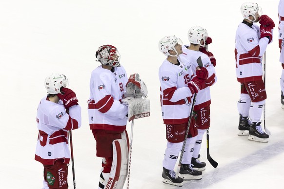 Lausanne's players look disappointed after losing against Geneve-Servette team during the shootout session, at the National League regular season game of the Swiss Championship between Geneve-Ser ...