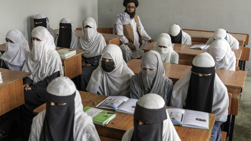 Afghan girls attend a religious school, which remained open since the last year's Taliban takeover, in Kabul, Afghanistan, Thursday, Aug 11, 2022. For most teenage girls in Afghanistan, it