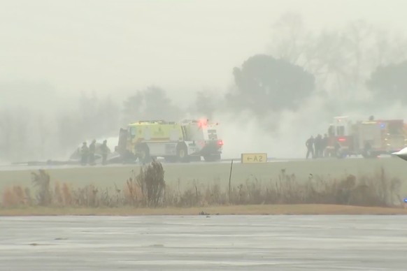 This screengrab made from video provided by WSOC shows firefighting crews responding to a reported plane crash at a regional airport in Statesville, N.C., erupting in a large fire, Thursday, Dec. 18,  ...