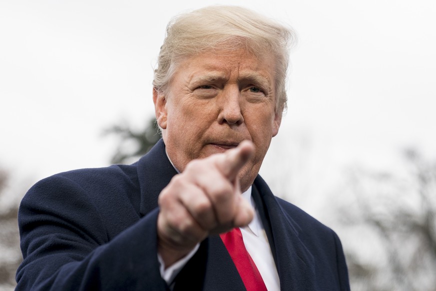 President Donald Trump calls on a reporter as he speaks to members of the media before boarding Marine One on the South Lawn of the White House in Washington, Monday, Nov. 26, 2018, for a short trip t ...