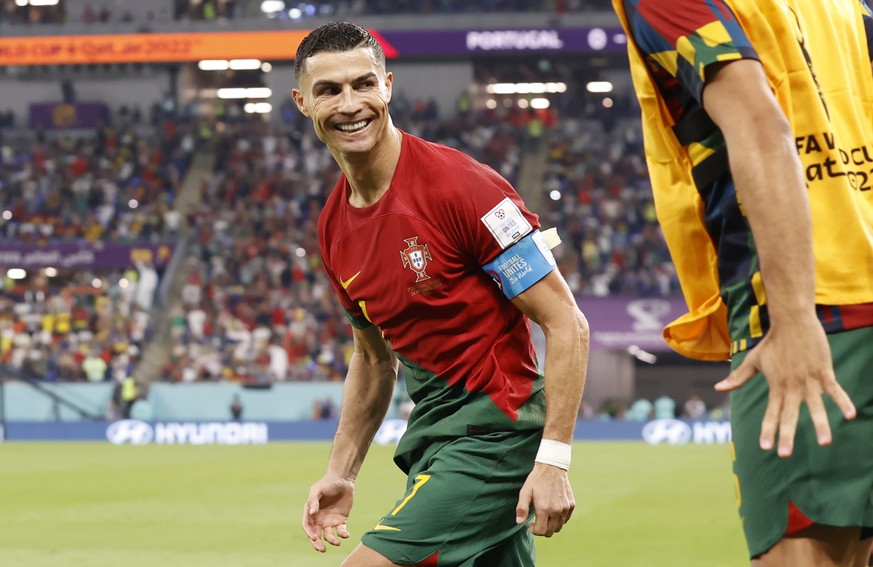 epa10325559 Cristiano Ronaldo of Portugal celebrates scoring the 1-0 by penalty during the FIFA World Cup 2022 group H soccer match between Portugal and Ghana at Stadium 947 in Doha, Qatar, 24 Novembe ...